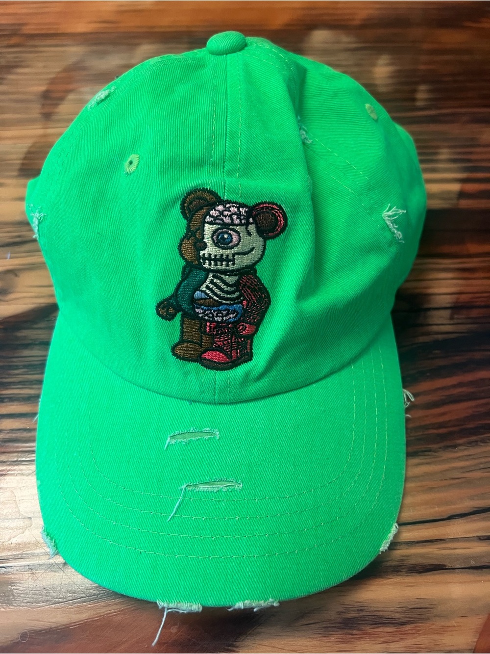 Green Distressed Baseball Cap with Embroidered Bear Patch